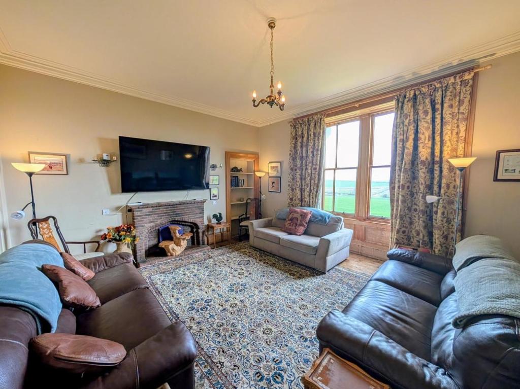 a living room with two couches and a television at 5 Bed in Melrose oc-89348 in Newtown Saint Boswells