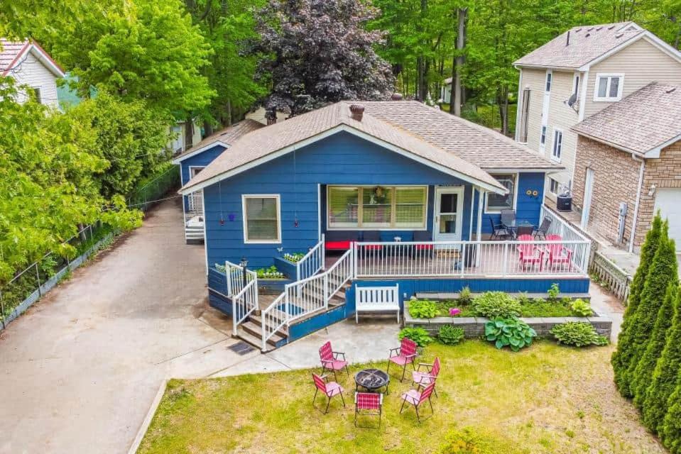 an aerial view of a blue house with a patio at Wavy Daze in Wasaga Beach in Wasaga Beach