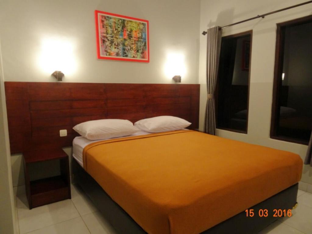 Una cama o camas en una habitación de Tara Bali Residence
