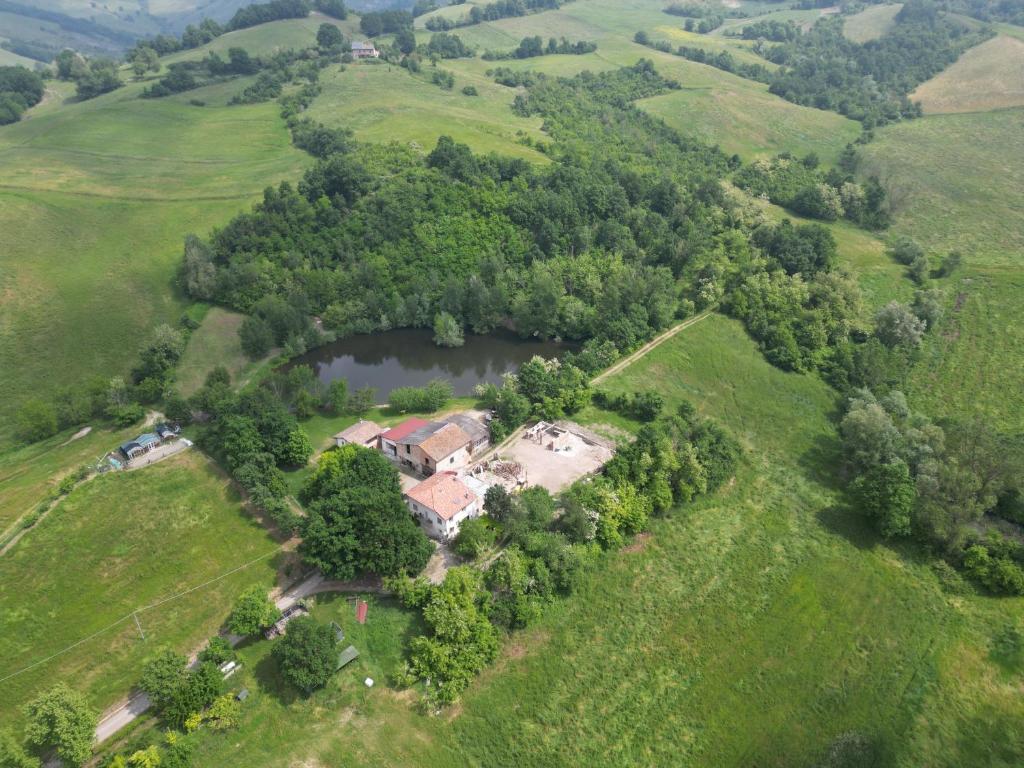 an aerial view of a house in a field at La Collina dei Conigli - immersi nella natura in Castellarano