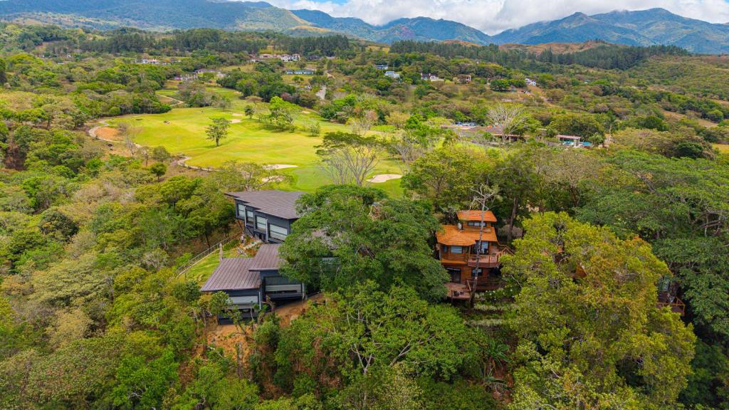 an aerial view of a house in the trees at Lucero Residences Golf & Wellness Resort in Boquete