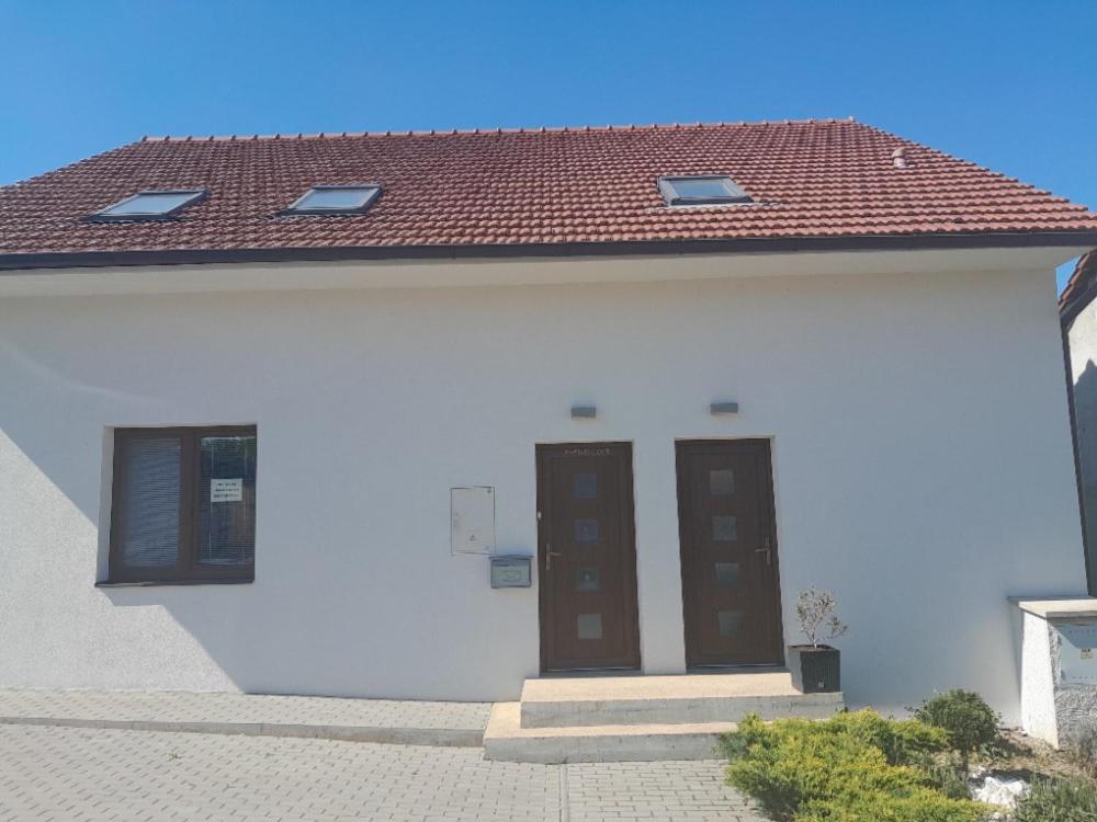 a white house with two doors and a red roof at Ubytování Hana Foltýn in Pavlov
