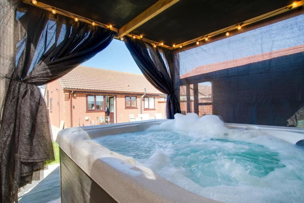 a jacuzzi tub with steam coming out of it at 2 Bed in Walcott oc-2301 in Walcott