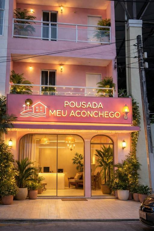 a building with a sign for a mexican restaurant at Pousada Meu Aconchego in Fortaleza