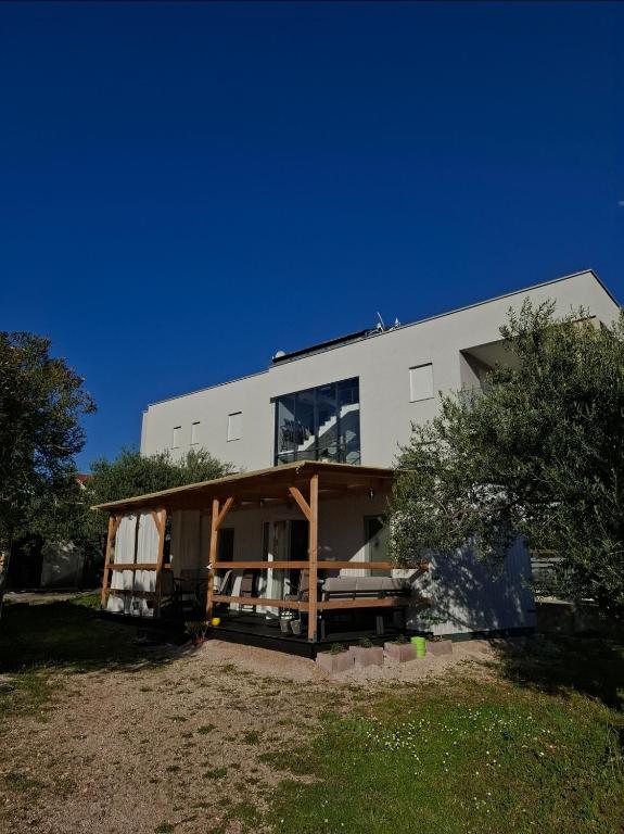 a large white building with a lot of windows at Camp Phoenix in Srima