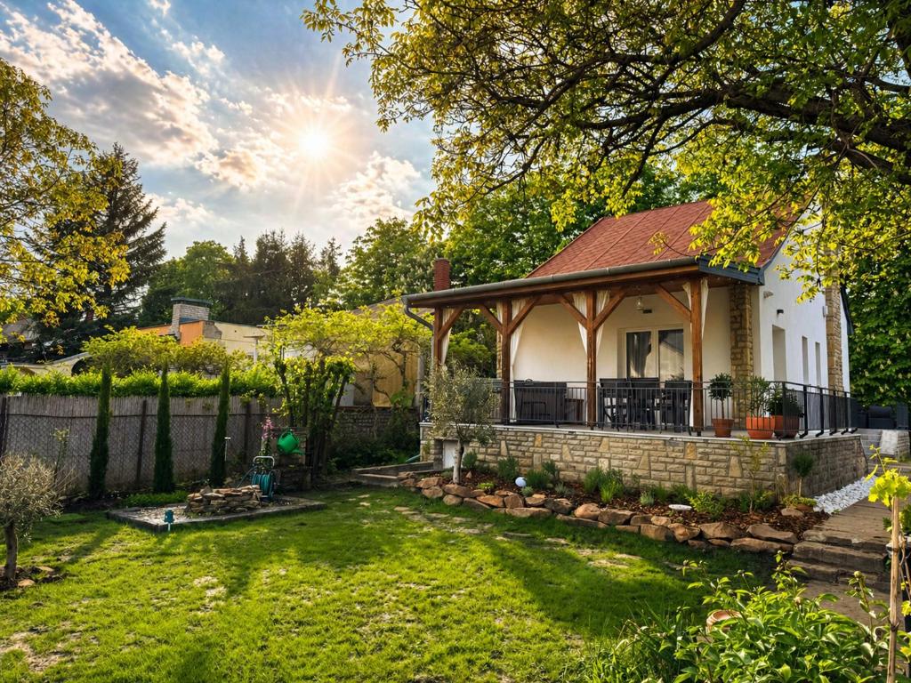 a house with a gazebo in a yard at Balaton Corner in Siófok