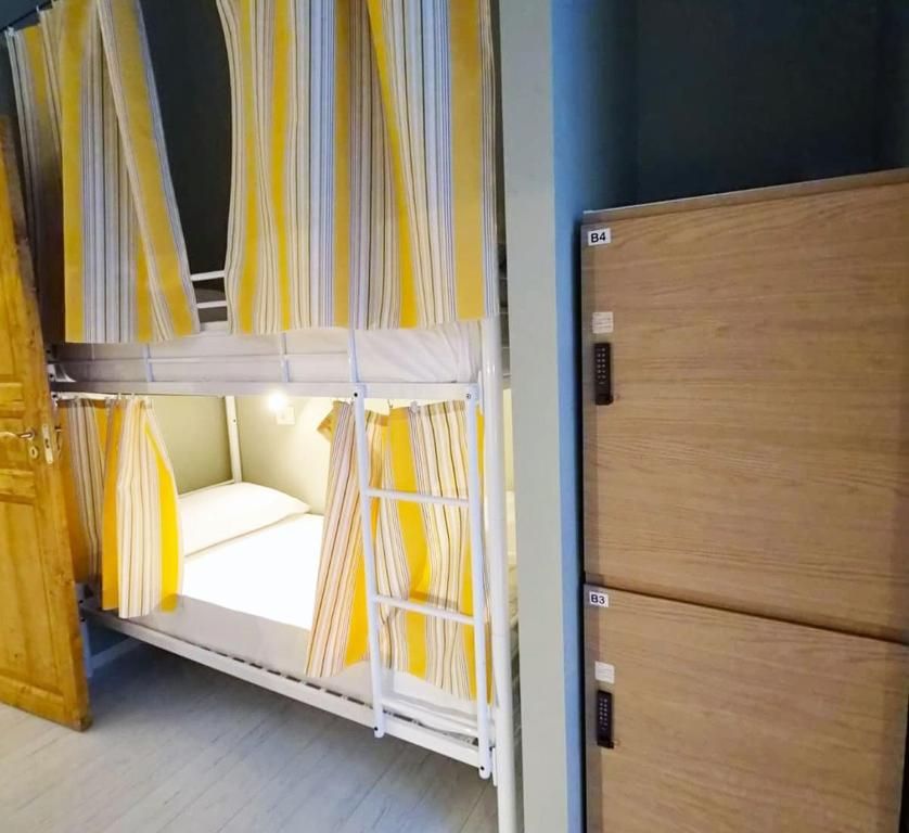 a room with two bunk beds in a room at Zippy Hostel in Milan