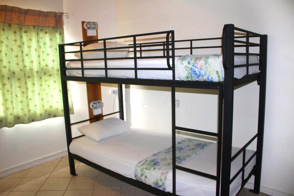 Postel nebo postele na pokoji v ubytování Bluewater Lodge
