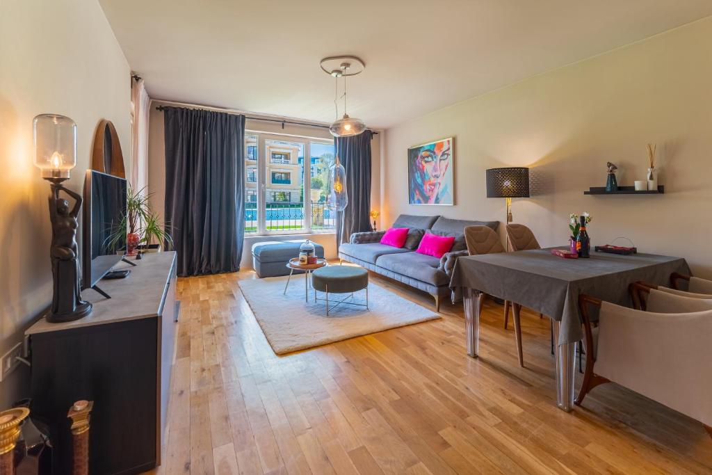 a living room with a couch and a table at Les Faberges in Carpe Vita in Varna City