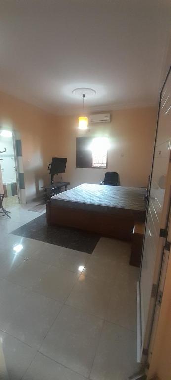 a bedroom with a large bed in a room at Bissau Residence in Bissau