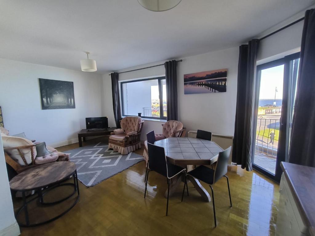a living room with a table and chairs at Bishops View in Galway