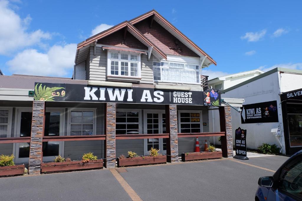 a kiwi as store in a parking lot at Kiwi As Guest House in Rotorua