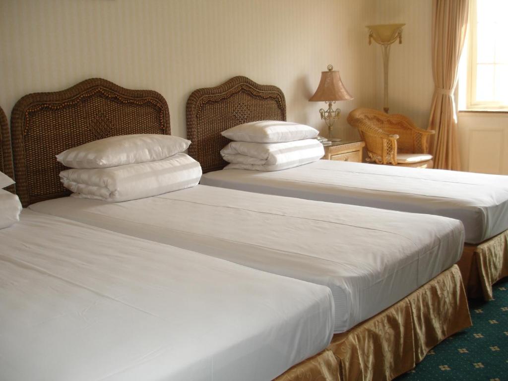 Postel nebo postele na pokoji v ubytování Life Leisure Resort