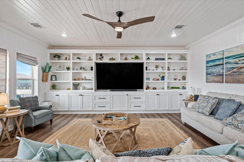a living room with a flat screen tv at Just Beach It! in Port Bolivar