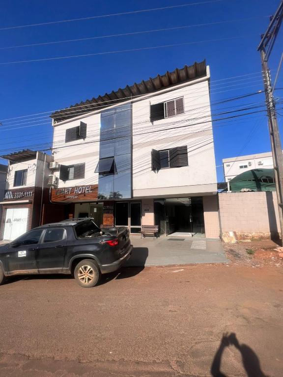 a car parked in front of a building at Aparth ijui hotel in Ijuí
