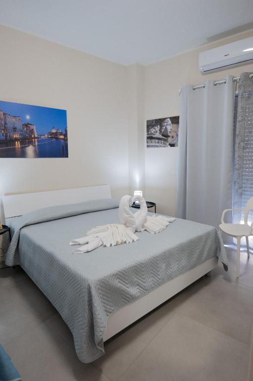 a bedroom with a bed with a stuffed animal on it at Umberto I in Nicosia