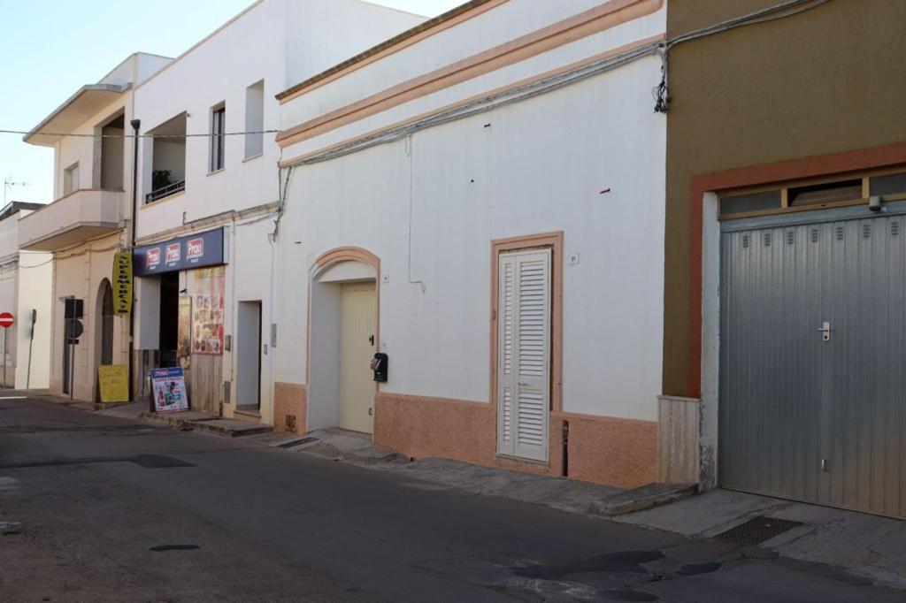 an empty street in a city with buildings at Villa Adriano in Salve