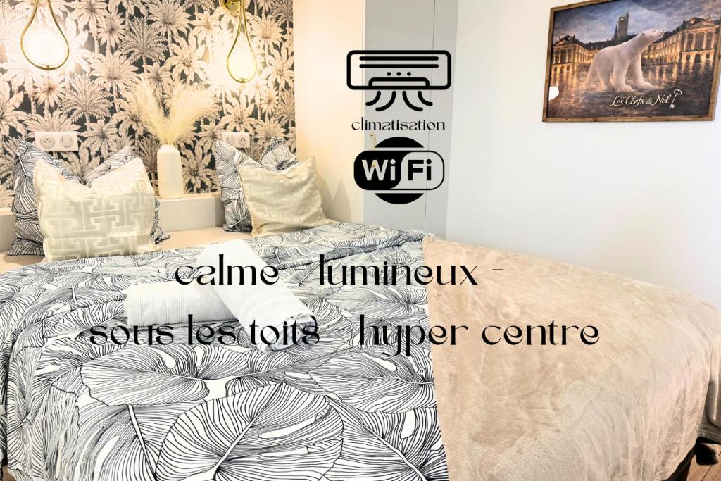 a bedroom with a bed and a wall with a mural at Petite Merveille sous les toits - Centre de Dijon in Dijon
