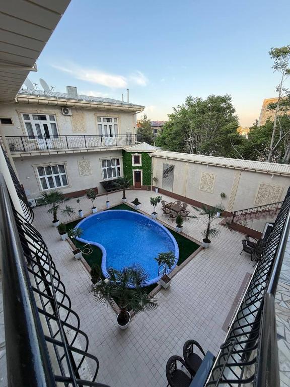 a view of a courtyard with a swimming pool at Global Star Hotel in Samarkand