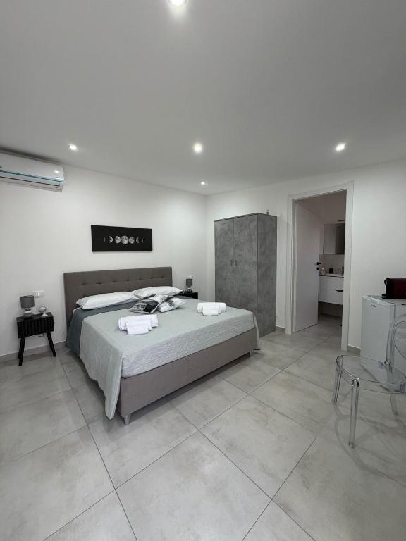 a bedroom with a large bed in a room at Marluna in Custonaci