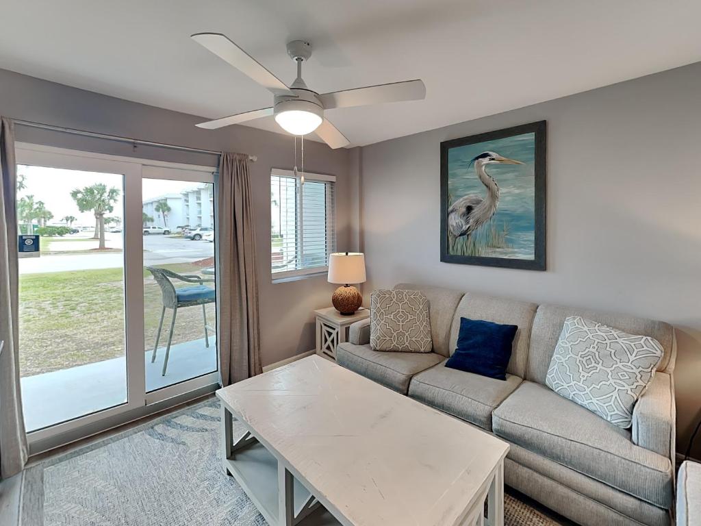 a living room with a couch and a table at Gulf Shores Plantation #4111 in Gulf Highlands