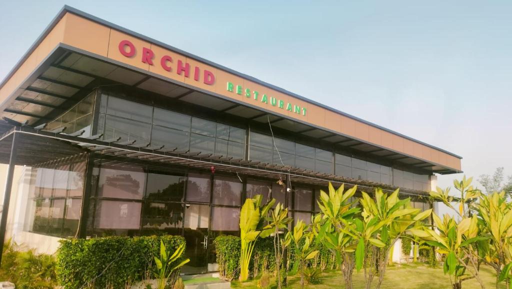 a building with a sign that reads or child malnutrition at Orchid resort in Sultānpur