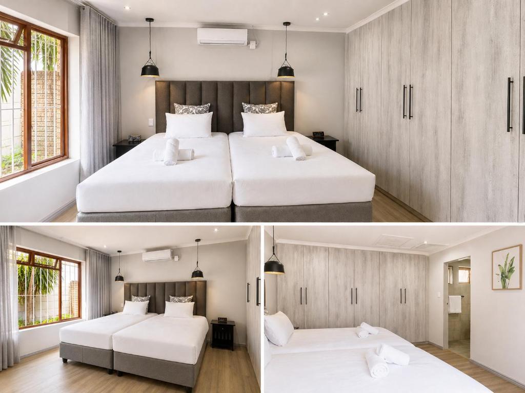 two beds in a room with white furniture at Cape one guest house in Welgelegen