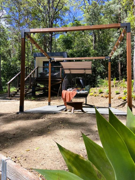 a gazebo with a grill in a yard at Sunset Ridge - King Bed Cabin & Breakfast Basket in Boyland
