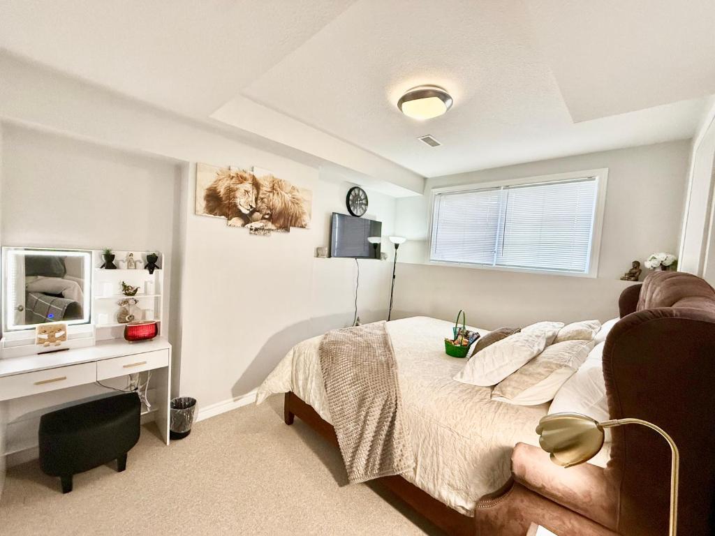 a bedroom with a bed and a desk at Room in niagara falls Pluto studio in Niagara Falls