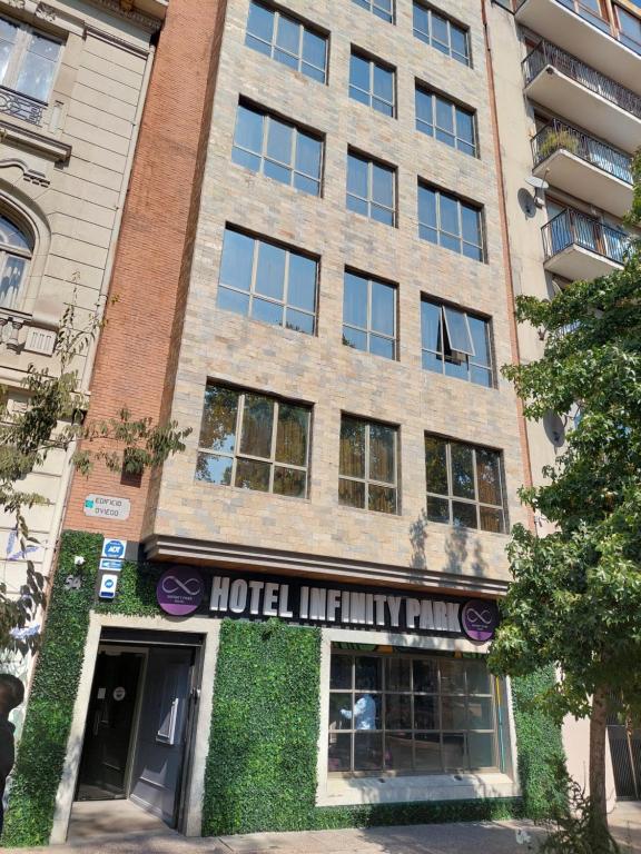 a building with a hotel liability sign in front of it at Infinity Park Hotel in Santiago