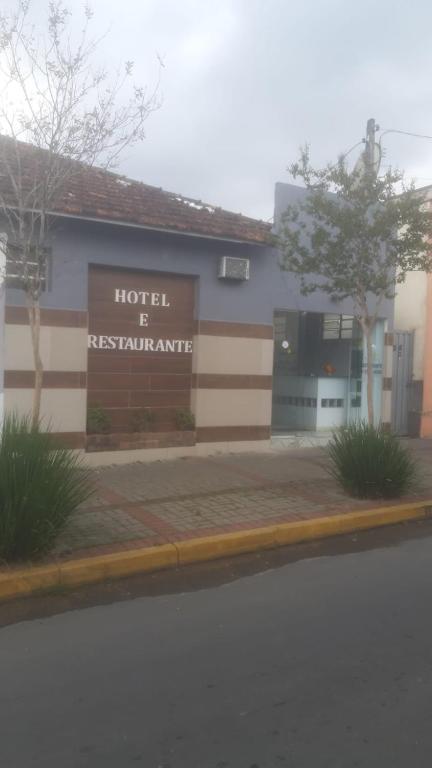 a hotel is maintenance sign in front of a building at Hotel Cidade Paisagem in Piquete