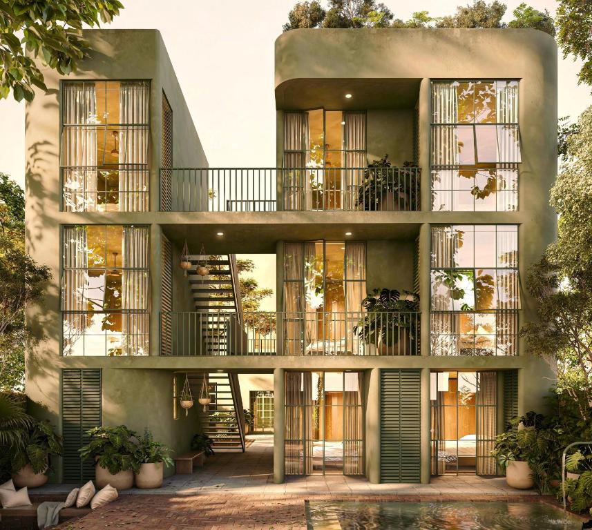 an apartment building with balconies and a courtyard at Hospedarte Central Hotel in Guadalajara