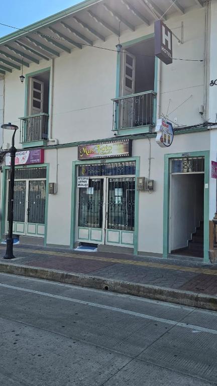 a building on the side of a street at Casa Hotel la Alsacia in Santa Rosa de Cabal