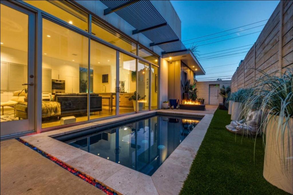 a swimming pool in the backyard of a house at Luxury 2BR 2BA w Pool and Large Pets Allowed in Dallas