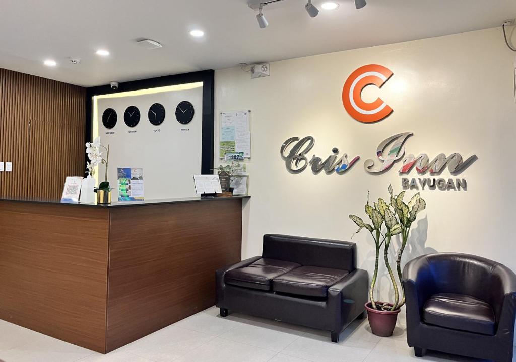 a waiting room with a chair and a cash register at Cris Inn - Bayugan in Bayugan City