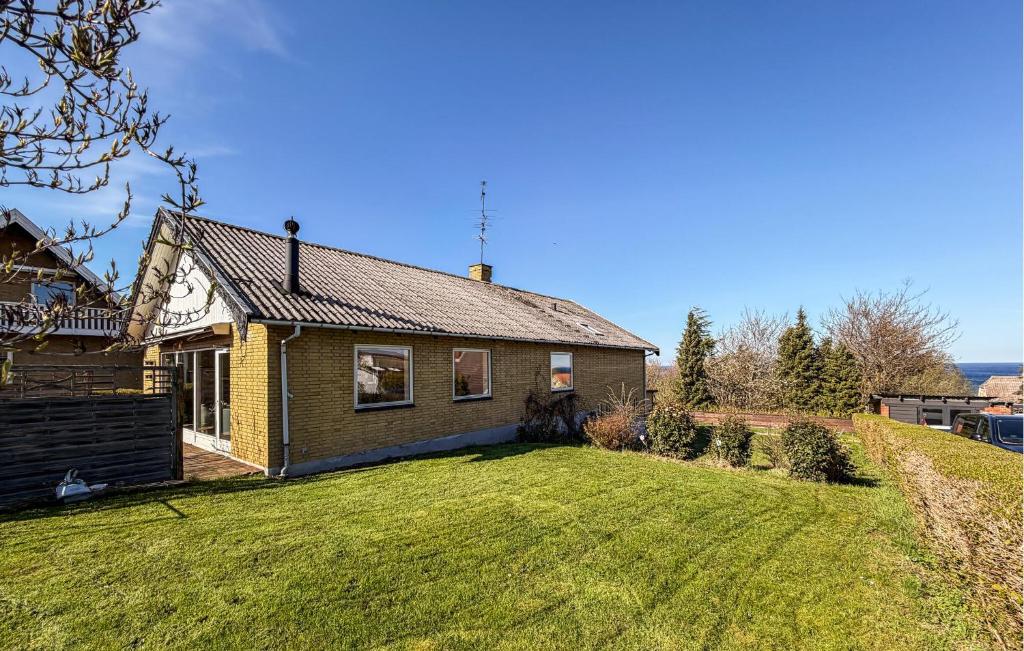 a house with a large yard in front of it at 4 Bedroom Cozy Home In Allinge in Allinge