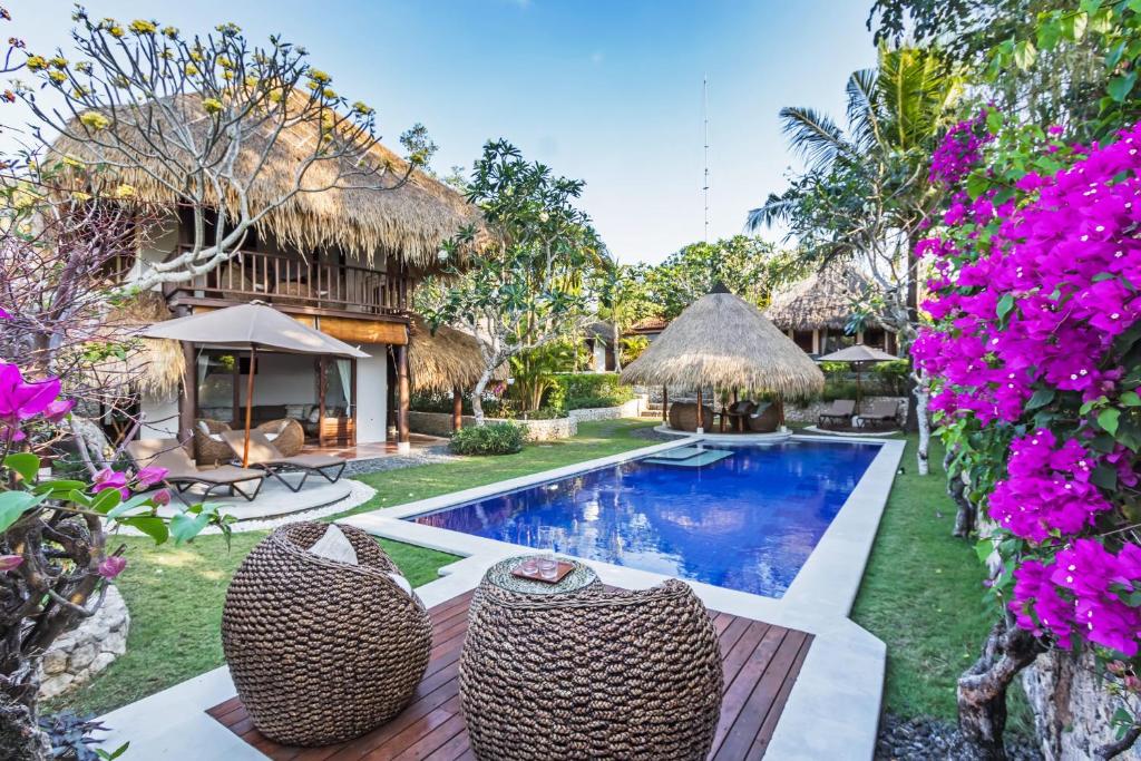 an image of a villa with a swimming pool at Jabeki Bungalows Bingin Beach, Uluwatu in Uluwatu