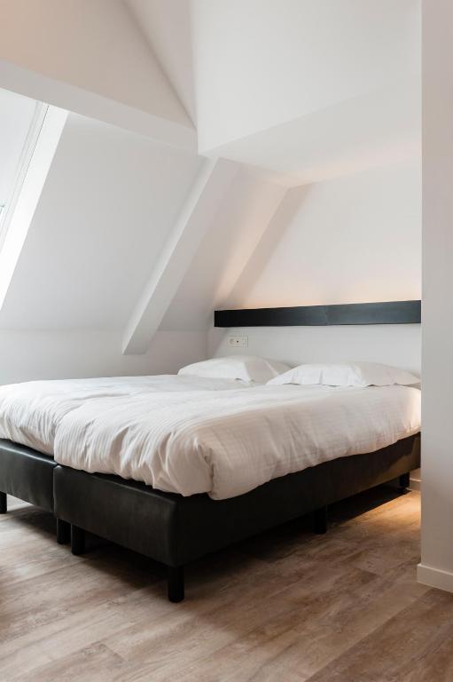 Postel nebo postele na pokoji v ubytování Hotel Portinari