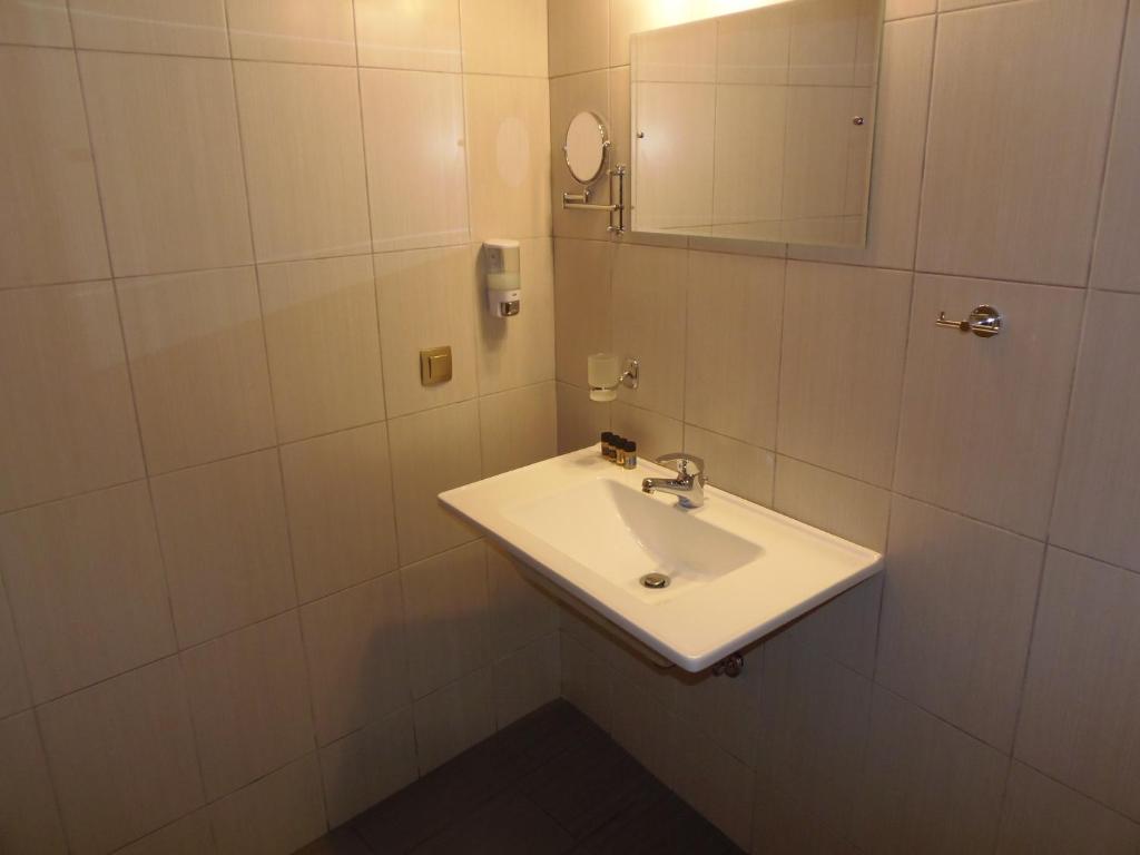 Koupelna v ubytování Hera Hotel