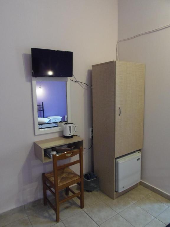 TV a/nebo společenská místnost v ubytování Hera Hotel