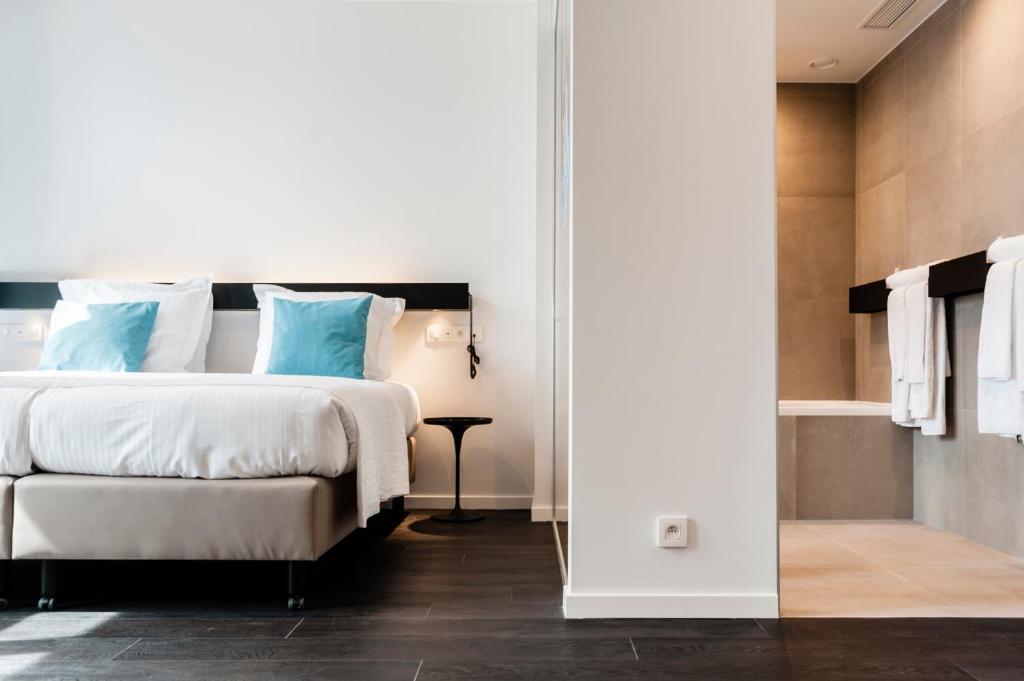 Postel nebo postele na pokoji v ubytování Hotel Portinari