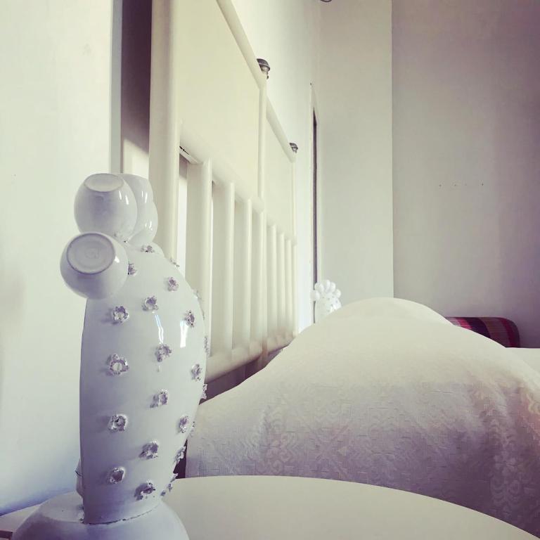 Postel nebo postele na pokoji v ubytování Volver B&B