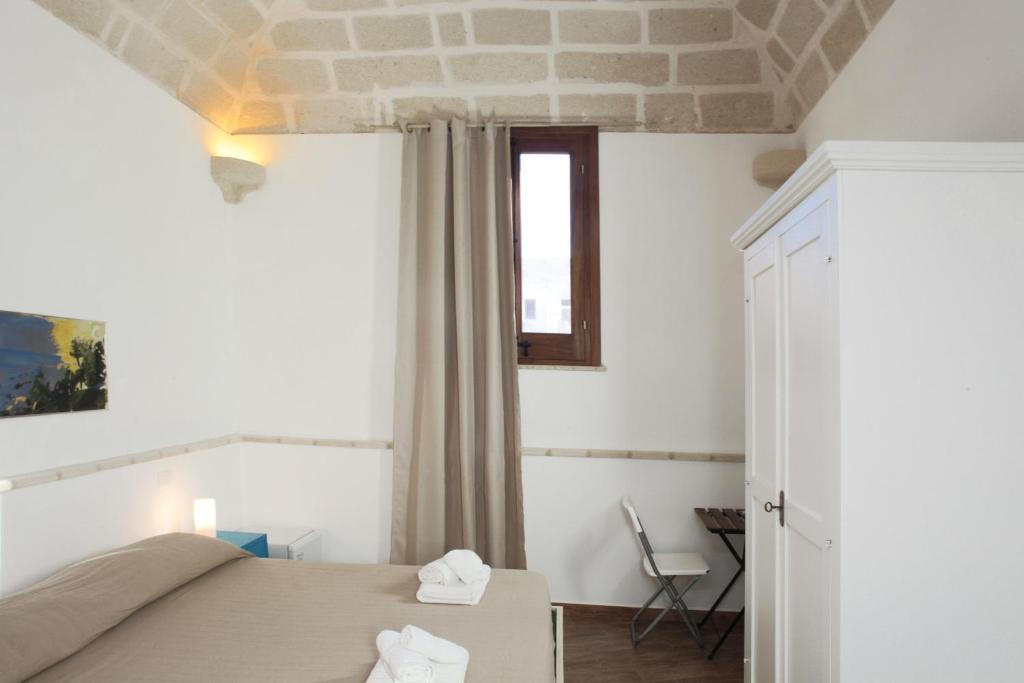 Postel nebo postele na pokoji v ubytování B&b Il Tufo