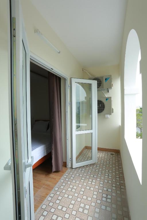 Postel nebo postele na pokoji v ubytování Gia Loi Hotel