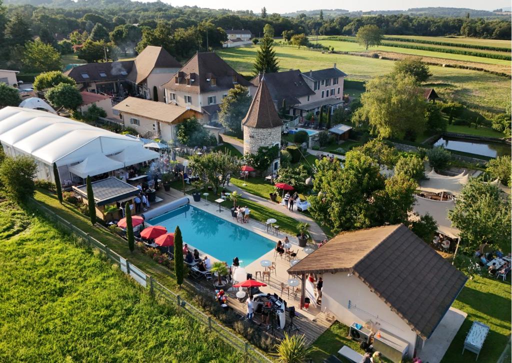 an aerial view of a resort with a swimming pool at Domaine de Suzel Hôtel & Spa in Vignieu