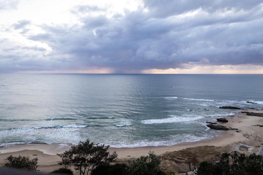 a view of the ocean on a cloudy day at Reflections Nambucca Heads - Holiday Park in Nambucca Heads