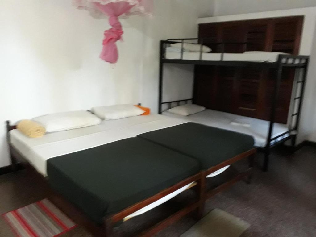 Postel nebo postele na pokoji v ubytování Drop Hostel