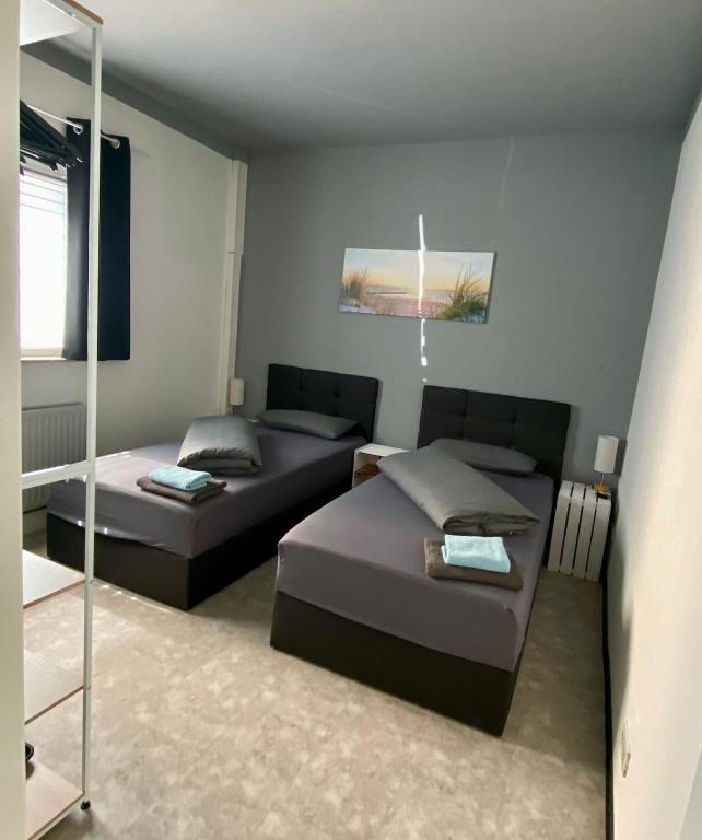 a living room with two beds and a couch at Ferienwohnung Freedom 3 Terrasse High End in Northeim