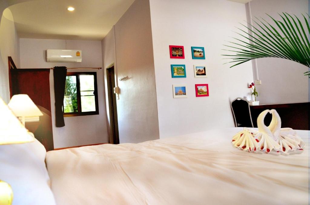 Postel nebo postele na pokoji v ubytování Chao Phraya Home
