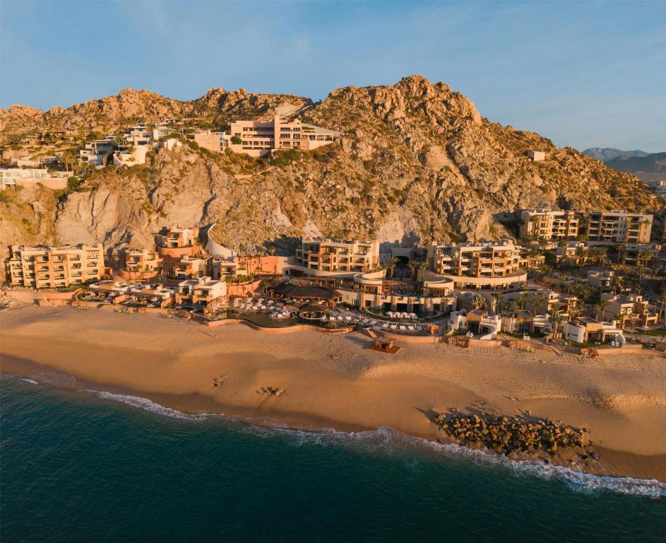 an aerial view of a beach with condos at Waldorf Astoria Los Cabos Pedregal in Cabo San Lucas
